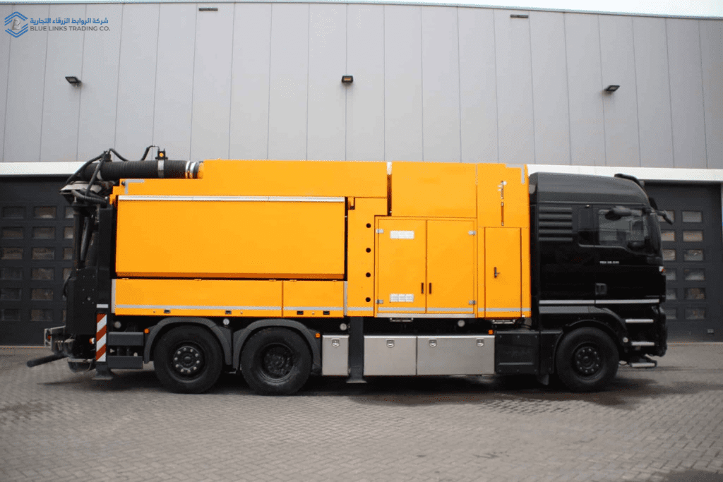 Side view of an MTS DINO 8 suction excavator with an 8 m³ capacity, showing the yellow body and suction unit mounted on a multi-axle chassis, designed for non-destructive excavation in infrastructure projects.