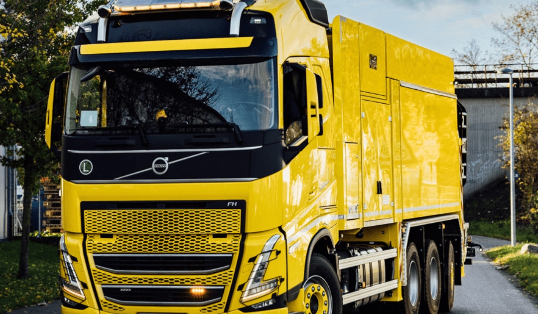 High-resolution MTS DINO suction excavator truck on the road showcasing advanced vacuum excavation technology.