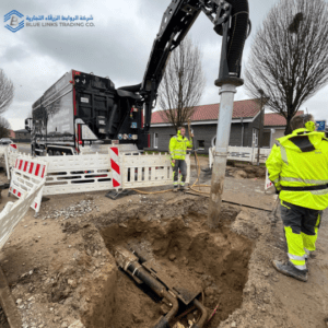 Excavation pit exposing underground utilities where vacuum excavation reduces the risk of damage compared to mechanical digging.