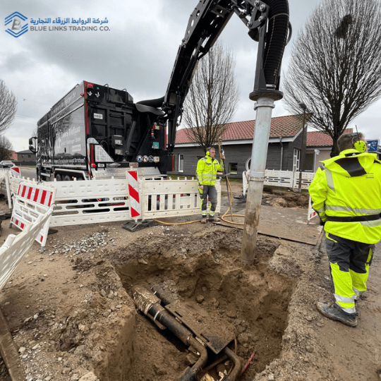 Excavation pit exposing underground utilities where vacuum excavation reduces the risk of damage compared to mechanical digging.