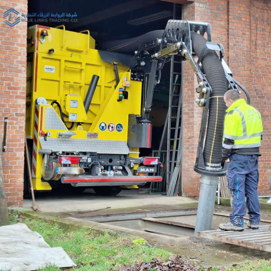 Operator using a controlled vacuum excavation tool for precise digging near sensitive infrastructure.