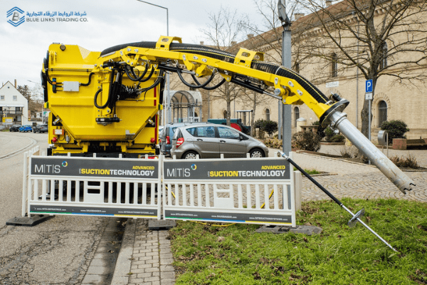 DINOCITY suction excavator performing precision excavation in a confined urban street